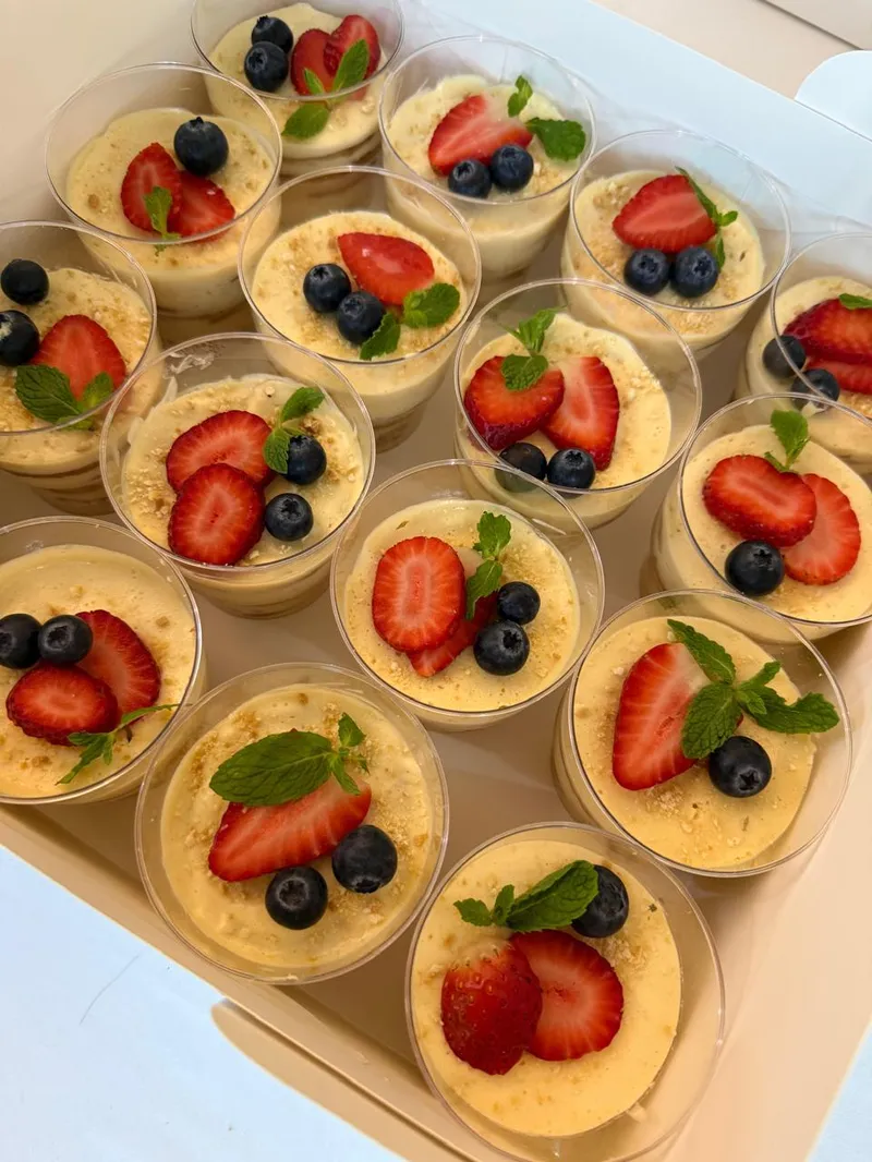 Lemon charlotte cups with strawberries, blueberries and mint