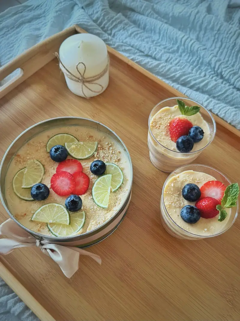 Lemon icebox cake with lime, strawberries and blueberries